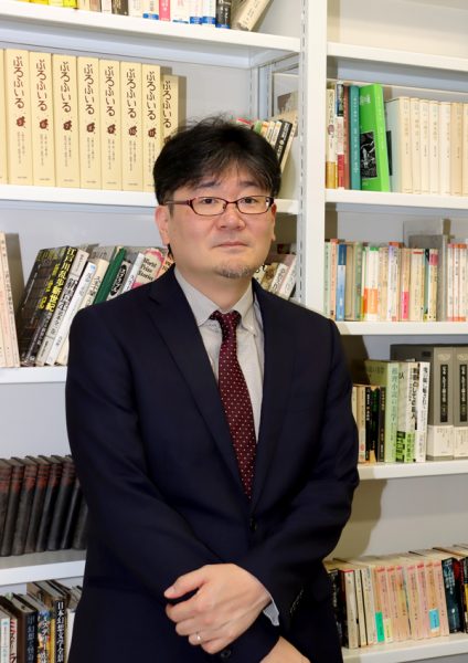 開 信介